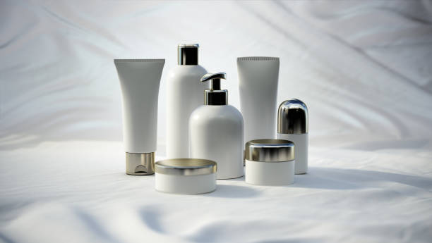 Various skincare product bottles and containers arranged on a white fabric backdrop.